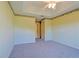 Well-lit bedroom with a large closet and carpet flooring at 352 Marion Oaks Ln, Ocala, FL 34473