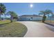 Home exterior showcasing a driveway and landscaping at 352 Marion Oaks Ln, Ocala, FL 34473