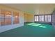 Bright Florida room with green carpet and pool view at 352 Marion Oaks Ln, Ocala, FL 34473