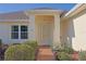 Inviting front entrance with a covered porch and walkway at 352 Marion Oaks Ln, Ocala, FL 34473