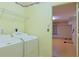 Laundry room with washer, dryer, and access to extra storage at 352 Marion Oaks Ln, Ocala, FL 34473