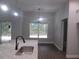 Dining room with elegant chandelier and large window at 13083 Sw 61St Place Rd, Ocala, FL 34481