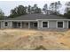 Charming single-story home showcasing stone accents and a symmetrical front facade at 13083 Sw 61St Place Rd, Ocala, FL 34481