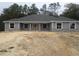 Charming single-story home showcasing stone accents and a symmetrical front facade at 13083 Sw 61St Place Rd, Ocala, FL 34481