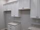 Bright kitchen featuring white cabinets and granite countertops at 13083 Sw 61St Place Rd, Ocala, FL 34481