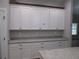 Bright kitchen featuring white cabinets and granite countertops at 13083 Sw 61St Place Rd, Ocala, FL 34481