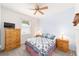 Cozy bedroom with ceiling fan and ample closet space at 9500 Sw 93Rd Loop, Ocala, FL 34481