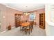 Formal dining room with wood furniture and neutral walls at 9500 Sw 93Rd Loop, Ocala, FL 34481