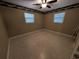 Bright bedroom with ceiling fan and terrazzo flooring at 1105 Ne 45 Pl, Ocala, FL 34479