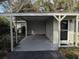 Covered carport with access to house and storage area at 1105 Ne 45 Pl, Ocala, FL 34479