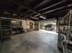 Garage with open door, showing a view of the driveway at 1105 Ne 45 Pl, Ocala, FL 34479