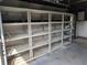 Garage with tall, empty shelving units for storage at 1105 Ne 45 Pl, Ocala, FL 34479