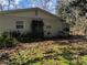 Side view of the house showing exterior and landscaping at 1105 Ne 45 Pl, Ocala, FL 34479