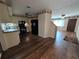 Kitchen with dark wood laminate flooring and black appliances at 1105 Ne 45 Pl, Ocala, FL 34479