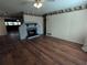 Spacious living room with hardwood floors and fireplace at 1105 Ne 45 Pl, Ocala, FL 34479