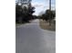 Quiet residential street with mature trees and houses at 1105 Ne 45 Pl, Ocala, FL 34479