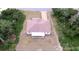 Aerial view of the house showing the fenced backyard area and surrounding trees at 15747 Sw 47Th Avenue Rd, Ocala, FL 34473