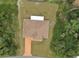 Aerial view showing a fenced backyard with lots of surrounding trees at 15747 Sw 47Th Avenue Rd, Ocala, FL 34473