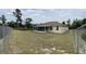 Wide backyard with chain link fence and screened in porch at 15747 Sw 47Th Avenue Rd, Ocala, FL 34473