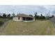 Spacious fenced backyard with a screened-in porch offering serene outdoor living at 15747 Sw 47Th Avenue Rd, Ocala, FL 34473