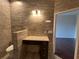 Bathroom vanity with granite countertop, dark cabinets, and view into next room at 15747 Sw 47Th Avenue Rd, Ocala, FL 34473