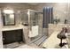 Bright bathroom featuring granite counters, glass shower, and elegant tile work at 15747 Sw 47Th Avenue Rd, Ocala, FL 34473