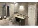 Bathroom with granite counters, vanity, and tiled walls at 15747 Sw 47Th Avenue Rd, Ocala, FL 34473