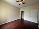 Bedroom featuring hardwood floors, ceiling fan and closet at 15747 Sw 47Th Avenue Rd, Ocala, FL 34473