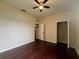 Bedroom featuring hardwood floors, ceiling fan and closet at 15747 Sw 47Th Avenue Rd, Ocala, FL 34473