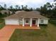 Well-maintained single-Gathering home with a charming facade and a manicured front lawn at 15747 Sw 47Th Avenue Rd, Ocala, FL 34473
