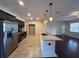 Modern kitchen boasting stainless steel appliances, granite countertops, and ample cabinet space at 15747 Sw 47Th Avenue Rd, Ocala, FL 34473