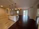 Open kitchen featuring granite counters, stainless appliances, and hardwood floors at 15747 Sw 47Th Avenue Rd, Ocala, FL 34473
