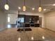 Elegant kitchen island with granite countertops, perfect for dining and entertaining guests at 15747 Sw 47Th Avenue Rd, Ocala, FL 34473