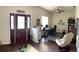Inviting living area featuring hardwood floors, natural light and comfortable seating at 15747 Sw 47Th Avenue Rd, Ocala, FL 34473