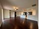 Open-concept living room with hardwood floors and kitchen views at 15747 Sw 47Th Avenue Rd, Ocala, FL 34473