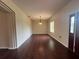 Bright living room showcasing hardwood floors, neutral walls, and an elegant light fixture at 15747 Sw 47Th Avenue Rd, Ocala, FL 34473