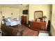 Main bedroom with hardwood floors, furniture, and natural light at 15747 Sw 47Th Avenue Rd, Ocala, FL 34473