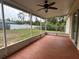 Covered patio with ceiling fan overlooking the backyard at 15747 Sw 47Th Avenue Rd, Ocala, FL 34473