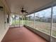Enclosed patio area with ceiling fan at 15747 Sw 47Th Avenue Rd, Ocala, FL 34473