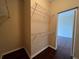 Walk-in closet with wire shelving and dark wood flooring at 15747 Sw 47Th Avenue Rd, Ocala, FL 34473