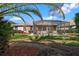 The backyard features a screened-in porch, grass, plants, and landscaping at 8655 Sw 86Th Cir, Ocala, FL 34481