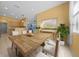 Bright dining room with tan walls, recessed lighting, adjacent to kitchen, and decorated with modern neutral decor at 8655 Sw 86Th Cir, Ocala, FL 34481