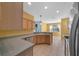 An open kitchen with light-colored cabinets and stainless steel appliances at 8655 Sw 86Th Cir, Ocala, FL 34481