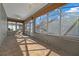 The bright sunroom features tile floors, a ceiling fan, and lots of windows at 8655 Sw 86Th Cir, Ocala, FL 34481