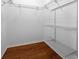 Spacious walk-in closet with custom organizers and hardwood floors at 8655 Sw 86Th Cir, Ocala, FL 34481