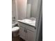 Bathroom featuring a toilet, tub, and vanity with cabinets and a large mirror at 6 Fisher Way Pl, Ocklawaha, FL 32179