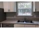 Kitchen with stainless steel sink, stainless steel appliances, and a view of the backyard at 6 Fisher Way Pl, Ocklawaha, FL 32179