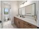 Modern bathroom with vanity, mirror, and adjacent toilet at 11098 Nw 50Th Ln, Ocala, FL 34482