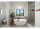 Spa-like bathroom featuring a freestanding tub and large shower at 11098 Nw 50Th Ln, Ocala, FL 34482