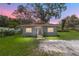 Gray house with red roof, steps, and grassy yard at 3331 Se 11Th Ave, Ocala, FL 34471